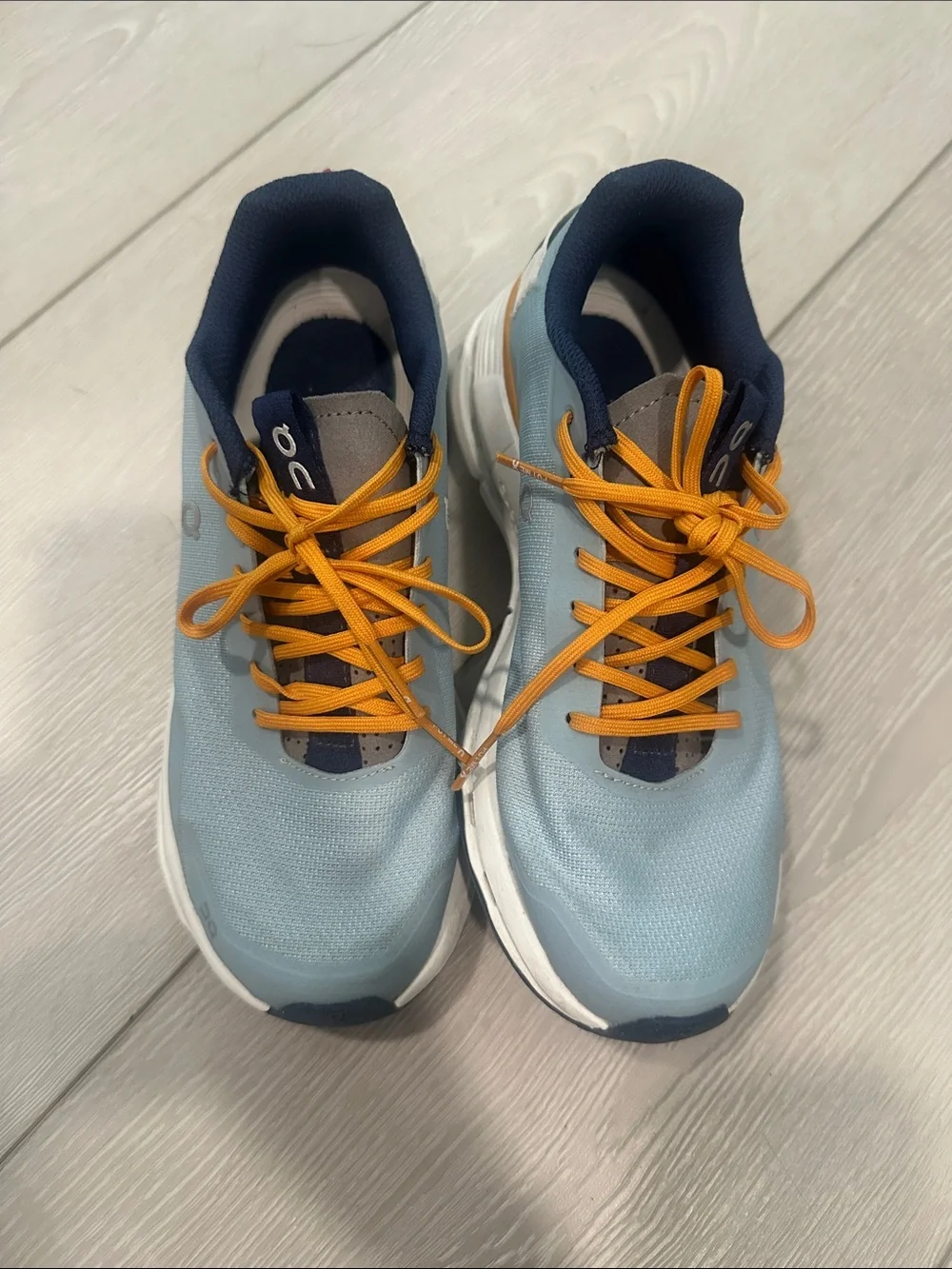 On Lightweight Women's Running Shoes in Light Blue and Orange